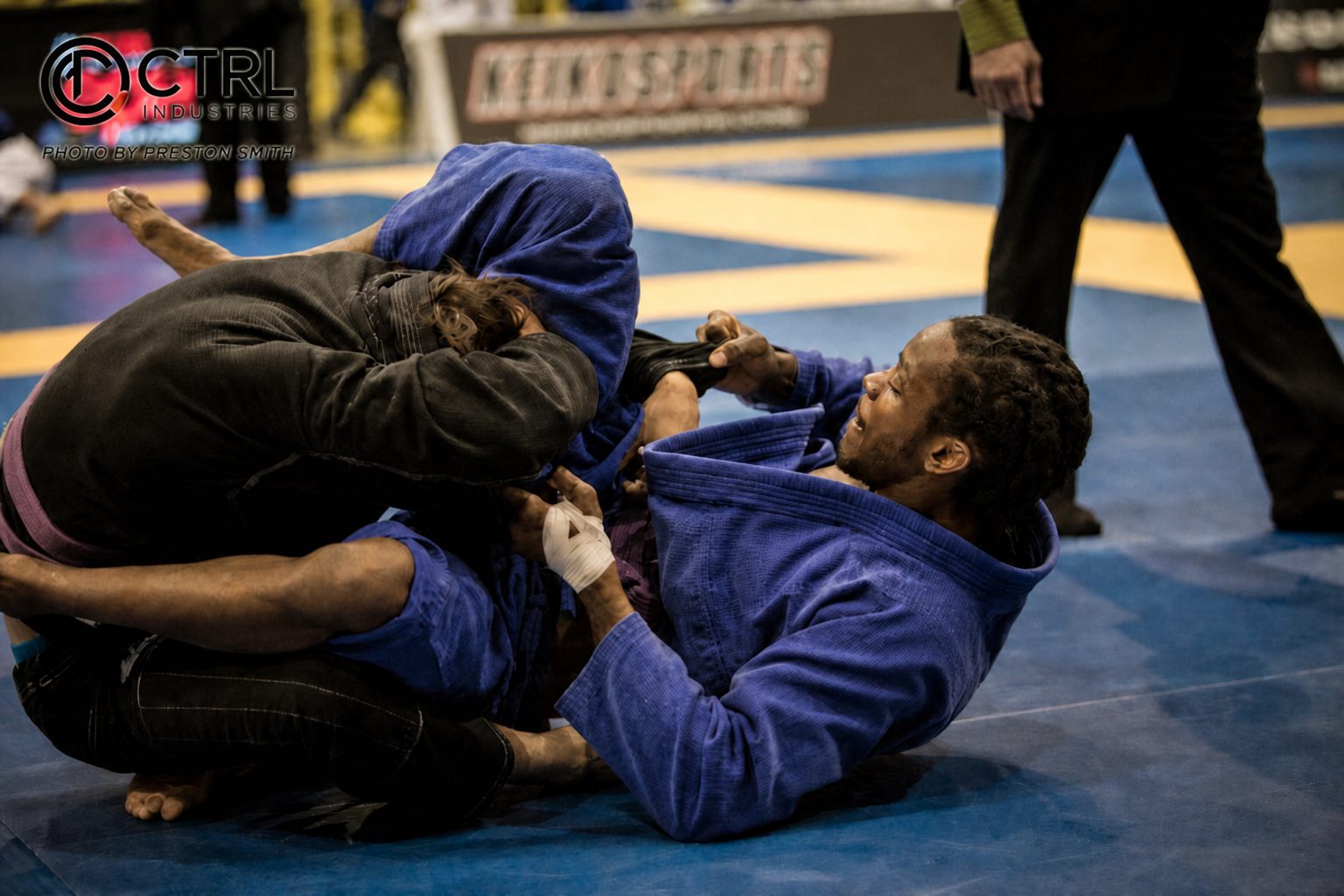 Brien Calloway competing as a purple belt, working from guard