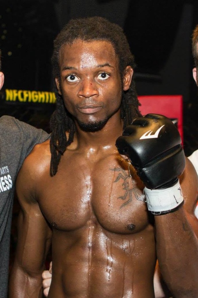 Brien Calloway after an NFC fight, wearing MMA gloves